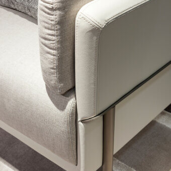 Exceptional Turri Zero sofa with platinum finish metal and light gray upholstery contrasted by textured textile cushions crafted in Italy