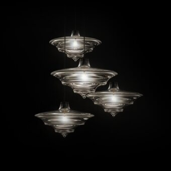 Distinguished WAYNE Enterprises WE-002 suspension lamp with tiered shades in extra clear crystal and dark metal holder