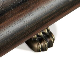 Wooden rod with bronze lion foot support, glossy dark brown finish, detailed paw pads, ornate rounded design, white background.
