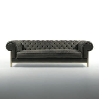Distinguished Bellavista My Chester Tuft sofa with dark gray leather and brass base crafted in classic Chesterfield design