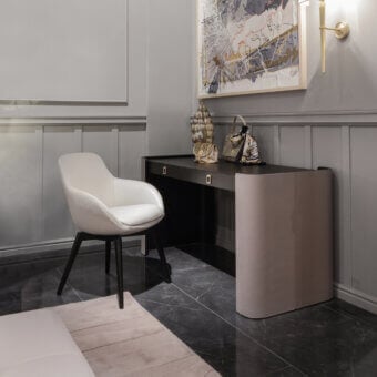 Elegant Formitalia Downtown armchair upholstered in smooth white fabric or leather with sleek dark wood veneer legs