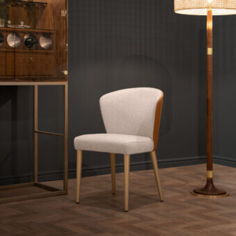 Elegant Formitalia Iside chair crafted in Italy with light fabric upholstery and golden-brown metallic lacquered legs