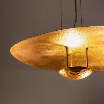 Lavish Stillux Cloud suspension lamp crafted in steel with a stylish hammered gold effect for warm light
