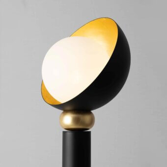 Distinguished Stillux Helo floor lamp with black metal tube supporting a matt white blown glass sphere and gold leaf finish