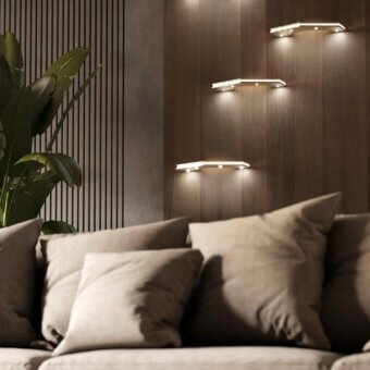 Innovative Stillux Otto wall lamp with geometric structure crafted in light tan hammered metal