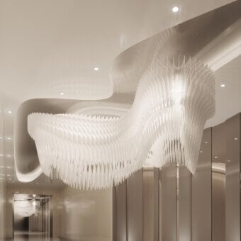 Distinguished Slamp Aria Infinita suspension lamp with layered white Lentiflex® creating a soft, diffused glow from 32 hanging points
