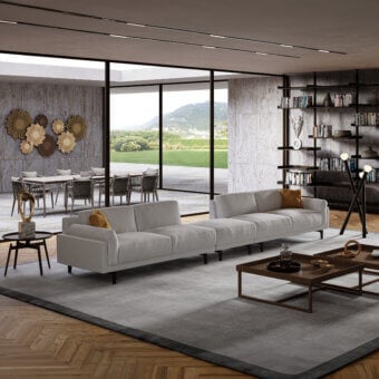 Superior Swan Italia Berry sectional upholstered in light gray textile with feather cushions and burnished metal feet