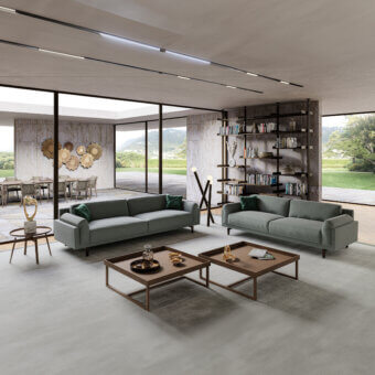 Lavish Swan Italia Berry sofa with uniform gray textile upholstery, feather cushions and burnished metal feet