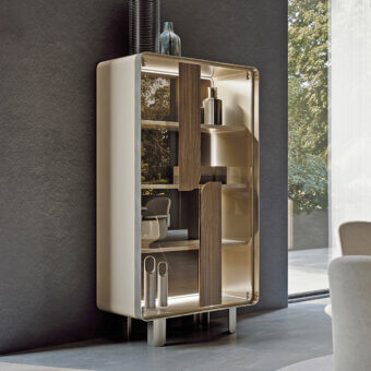 Distinguished Turri Soul cupboard with light cream lacquered wood and transparent glass doors showcasing wood applications within a metal frame
