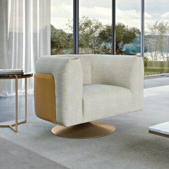 Elegant Turri Soul lounge chair with light beige woven textile and caramel leather panels, built with a bronze metal swivel base