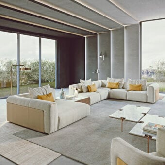 Superior Turri Soul sectional with light beige woven textile upholstery and tan leather accents