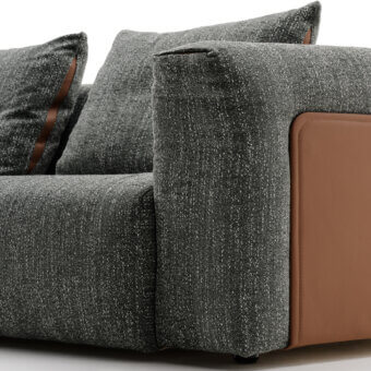 Superior Turri Soul sofa crafted in dark gray textile with warm brown leather panels and inserts