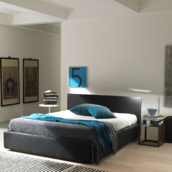 Elegant Bolzan Letti bed upholstered in dark gray textile with a firwood structure and removable cover