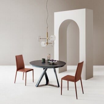 Exceptional Bontempi Millennium round extendable table with a dark tabletop and geometrically shaped metal base crafted in Italy