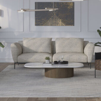 Distinctive Horm Ella sofa, a seating option upholstered in light neutral textile with a thin dark metal base