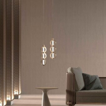 Elegant Stillux Chain suspension lamp with interconnected metal rings and frosted pyrex glass tube in a light gold finish