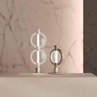 Superior Stillux Chain table lamp with refined metal and frosted pyrex glass tube, finished in neutral matte silver or gray tone
