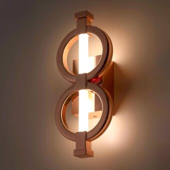 Elegant Stillux Chain wall lamp with crossed metal rings and frosted pyrex glass tube in a rose gold glossy finish