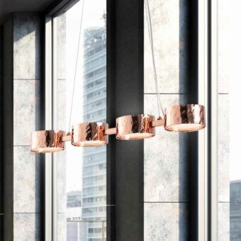 Exceptional Stillux Circle suspension lamp with four circular matt white glass diffusers encircled by warm glossy copper frames