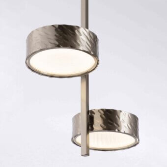 Distinguished Stillux Circle suspension lamp with vertically arranged circular matt white glass diffusers encased in hammered metal frames