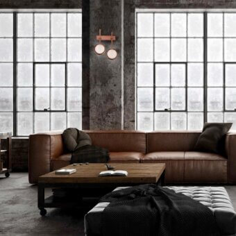 Elegant Stillux Circle wall lamp with circular matt white glass diffusers encased in hammered metal with copper-like finish