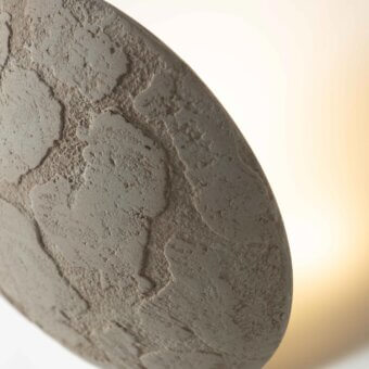 Superior Stillux Orbis wall lamp crafted in Italy with a circular form and hammered metal finish in medium gray