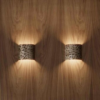 Distinguished Stillux Random wall lamp with curved hammered metal and dark mottled grey finish projecting light upward and downward