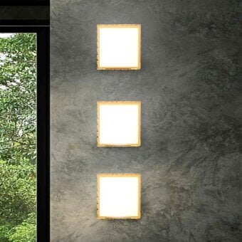 Superior Stillux Square wall lamp with a hammered metal frame and square white glass diffuser in golden finish