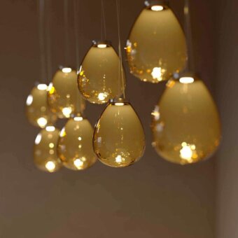 Distinguished Stillux The Light suspension lamp with chrome metal and a warm transparent amber Certified Lead Crystal diffuser