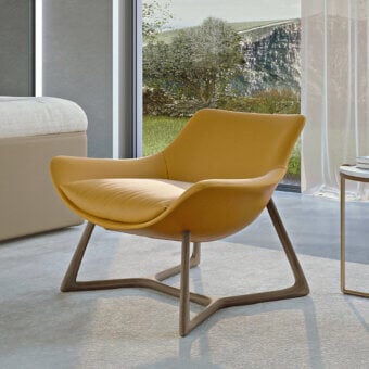 Exceptional Turri Harp Lounge Chair with smooth yellow leather upholstery and solid walnut wood base construction
