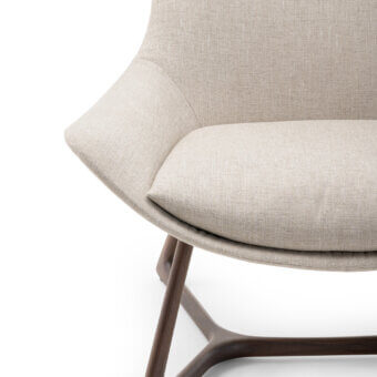 Distinguished Turri Harp Lounge Chair with light beige upholstery and a solid walnut wood base crafted with a dark tone finish