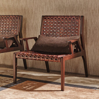 Distinguished Turri Net Lounge Chair with woven saddle leather and walnut wood built with a dark brown stain