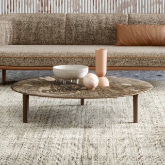 Exceptional Turri Riban coffee table with rounded silhouette, marble top and matte brown leather detailing