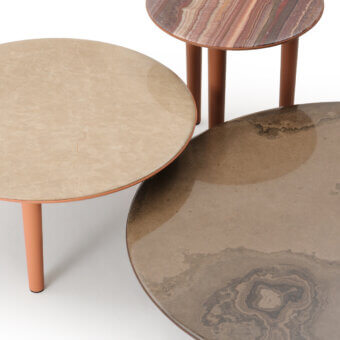 Distinguished Turri Riban coffee table with organic form, beige marble top and orange leather-covered legs crafted in Italy