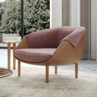 Distinguished Turri Riban lounge chair with speckled mauve textile upholstery and smooth matte tan frame construction