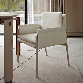 Elegant Turri Zenit armchair with light beige matte leather upholstery and sleek metal legs