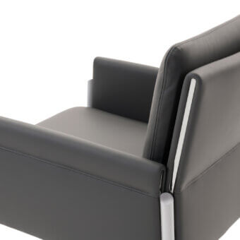 Distinguished Turri Zenit armchair with sleek metal legs and angular form in matte gray synthetic leather upholstery