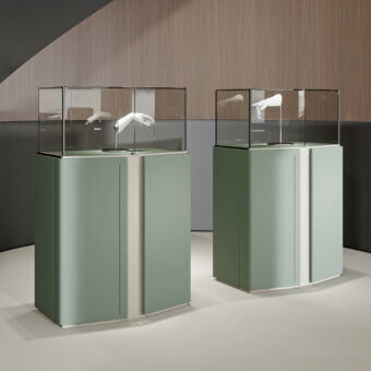 Exceptional Turri Zenit cupboard with muted green leather doors and a light display case built in Italy