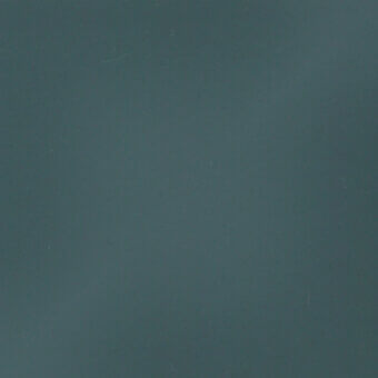 Charcoal gray matte texture sample displaying a uniform, smooth surface with subtle tonal variations and faint, scattered marks under diffuse lighting.