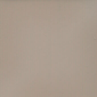 Smooth gray paint surface with matte finish, displaying subtle tonal variations and minor imperfections across a flat, evenly lit plane.