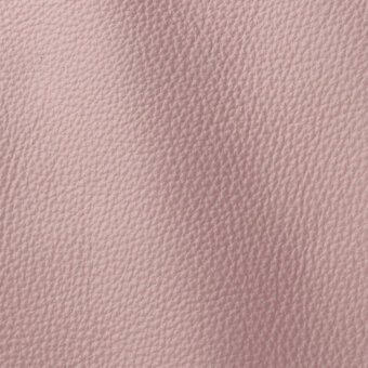 Soft pink leather texture with a subtly pebbled grain, matte finish, and uniform color, displaying a dense yet pliable material surface.
