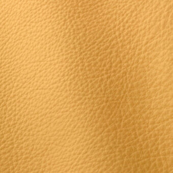 Golden-yellow full-grain leather texture with a granular, pebbled surface and subtle tonal variations, displaying a smooth, natural sheen.