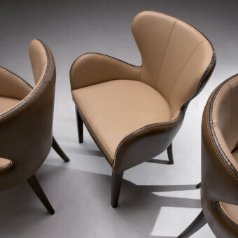 Superior Borzalino Elektra armchair upholstered in light tan leather with dark brown trim and chromed metal details