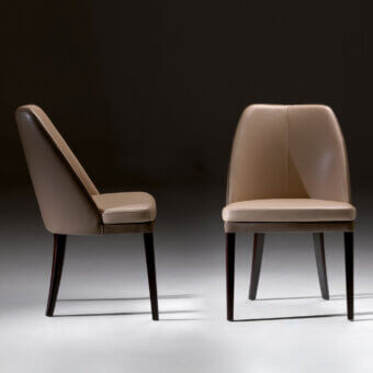 Refined Borzalino Julie chair with a light tan synthetic upholstery and dark brown lacquered natural oak legs