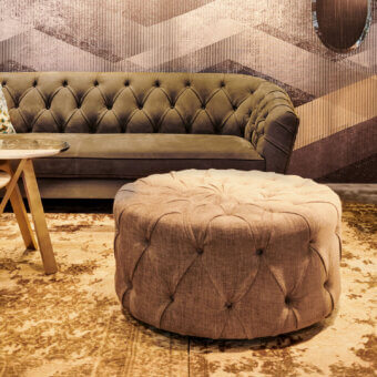 Distinguished Borzalino New Kap ottoman crafted in light brown textile with matte finish and meticulous handmade capitonné quilting