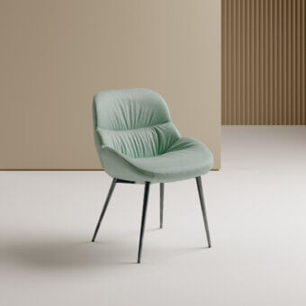 Elegant Bontempi Amelie chair with light green upholstered seat and back, built with rounded dark metal spindle legs