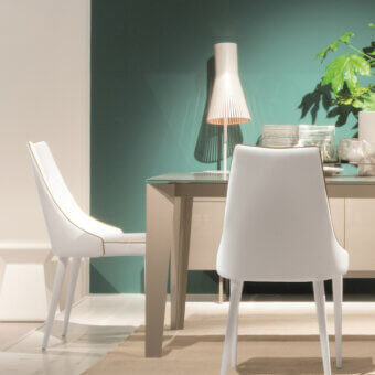 Distinguished Bontempi Clara chair with pristine white upholstery and frame accented by delicate gold piping