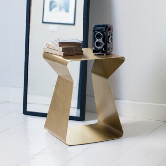 Elegant Bontempi Kito side table with sculptural metal form and uniform gold tone finish