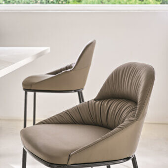Elegant Bontempi Queen bar stool with light brown subtly textured upholstery and sleek black metal frame
