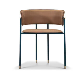 Mac armchair, tan leather upholstery, teal metal frame with brass accents, minimalist design, studio shot, clean lines, horizontal leg bar.